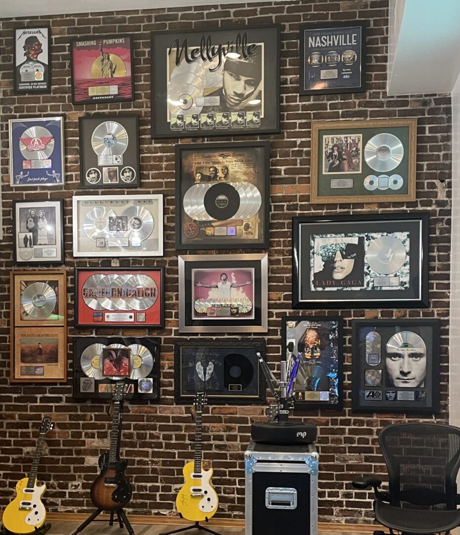 A wall of various records and music memorabilia.